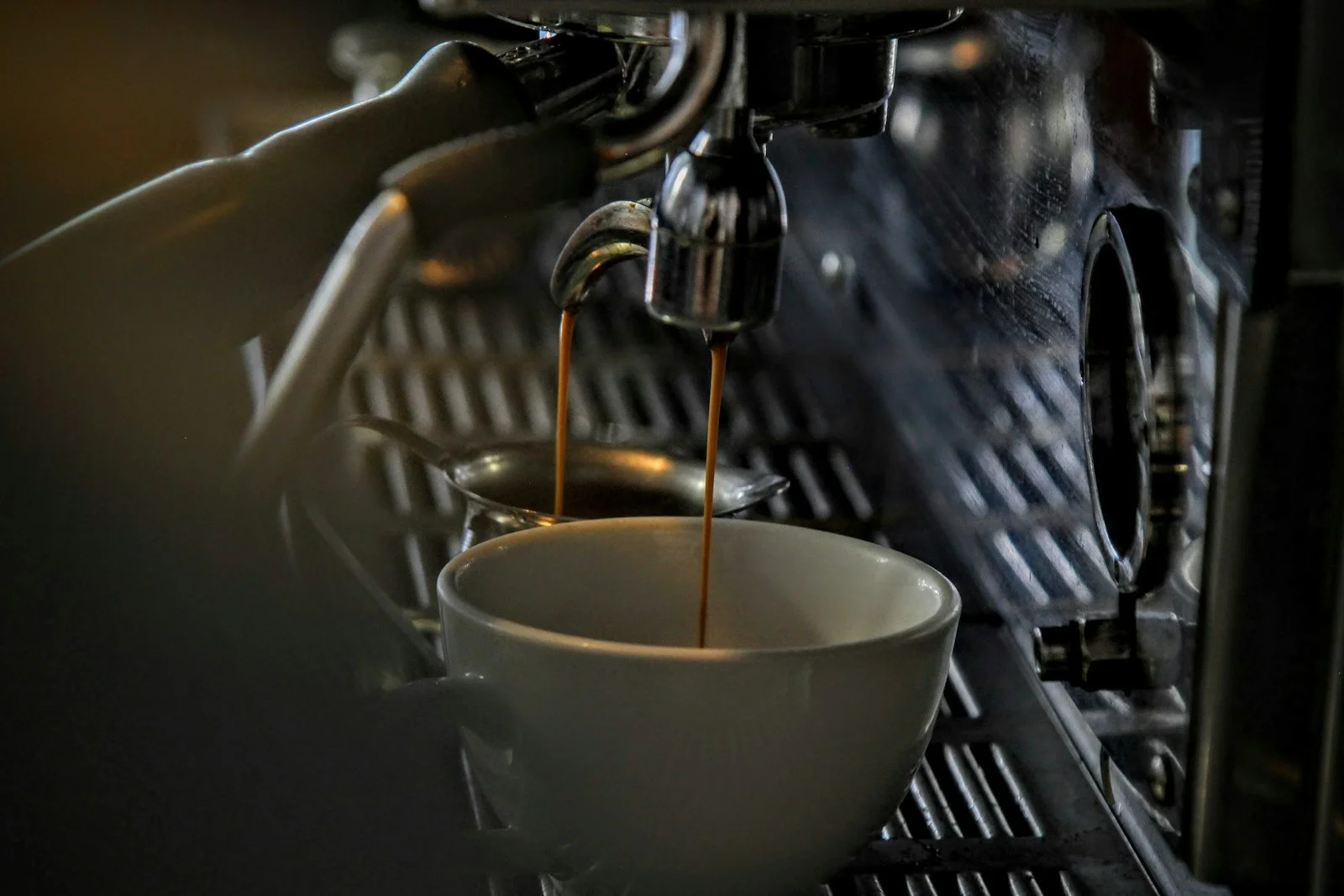 Pouring a freshly brewed cup of coffee